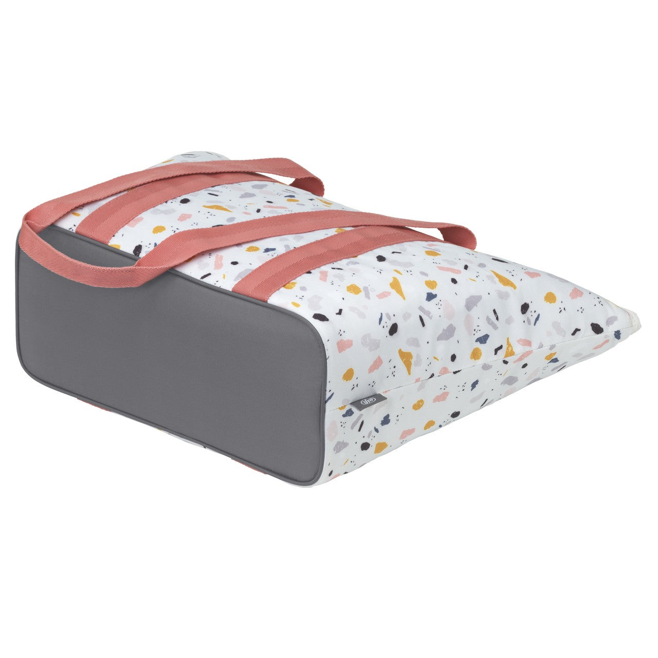 Das Bild zeigt eine Tragetasche mit einem kissenähnlichen Aufbau und zwei Griffen. Die Seiten sind grau, während die Oberseite mit einem bunten, gesprenkelten Muster in Pastelltönen verziert ist. Die Griffe sind in einem sanften Rosa gehalten.