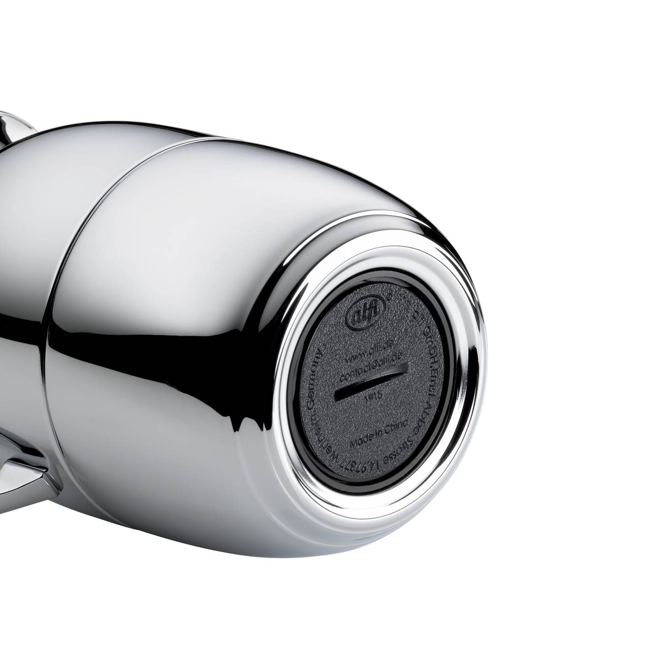 Das Bild zeigt ein modernes, metallisch glänzendes zylindrisches Objekt mit einer schwarzen, runden Oberfläche am Ende. Auf der schwarzen Fläche sind einige kleine Beschriftungen und ein Schlitz zu sehen.