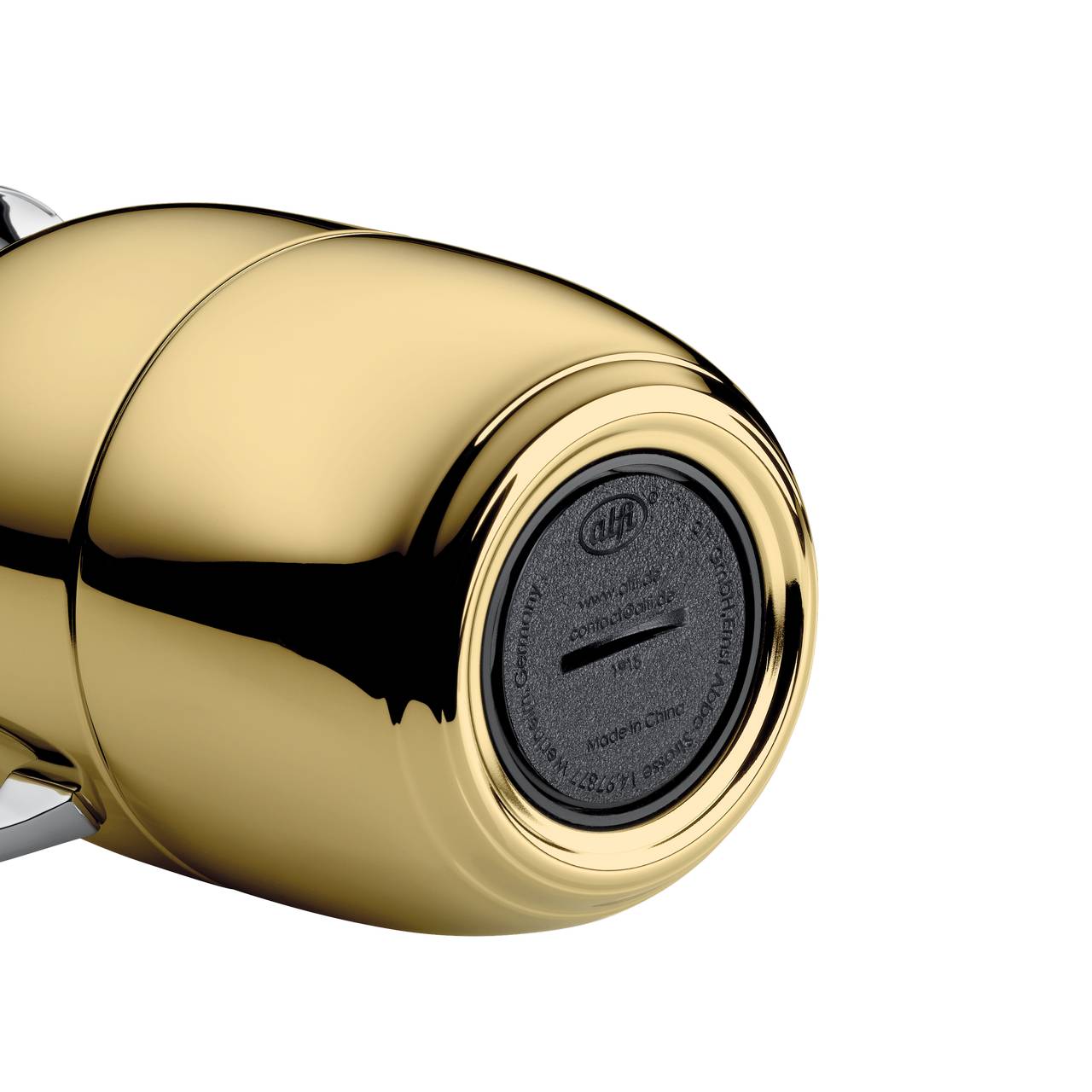 Das Bild zeigt ein glänzendes, zylindrisches, goldfarbenes Objekt mit einer glatten, reflektierenden Oberfläche. Am Ende ist eine schwarze Abdeckung mit eingeprägten Zeichen.